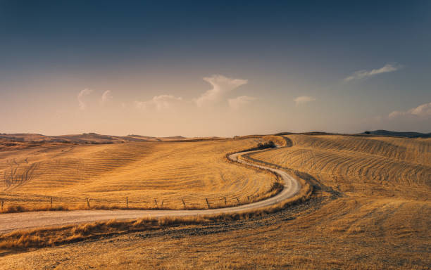 istock Winding road through Tuscany at sunset. Italy. 941866696