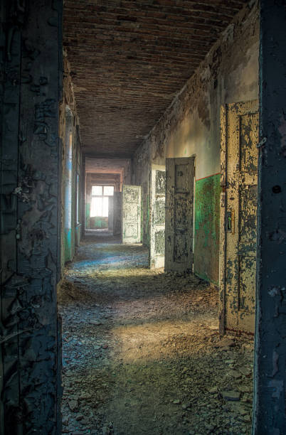 istock A long corridor with many open doors of a lost place 941867540