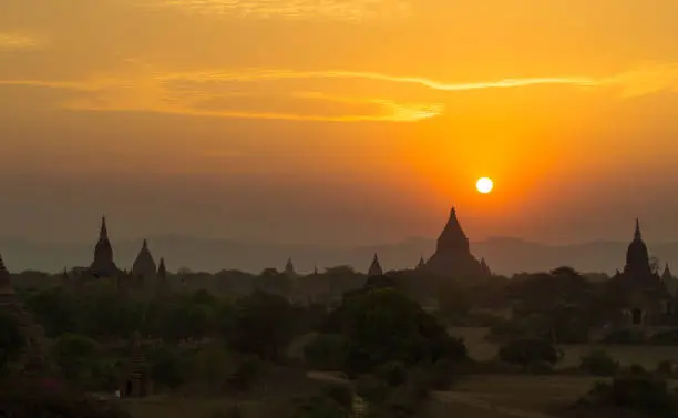 Beautiful sunset over the old Buddhist temples in ancient city of Bagan, Myanmar