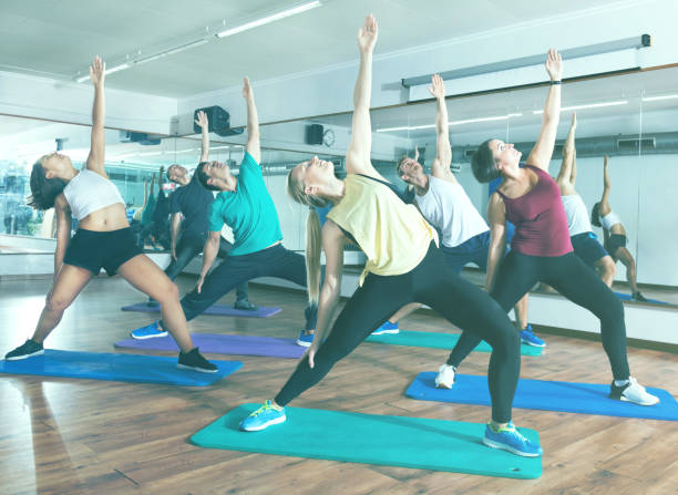 istock Happy adults having group fitness class 941870766