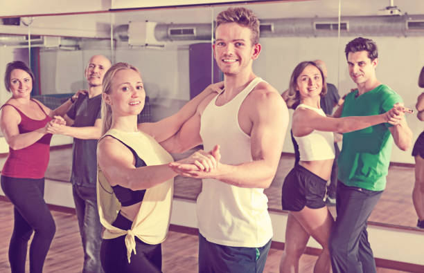 istock Men and women dancing salsa o bachata 941870834