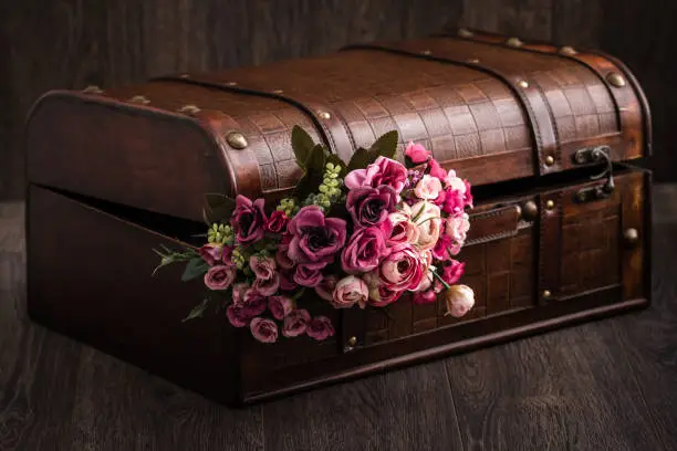 Beautiful decorative trunk treasure chest storage box on brown background