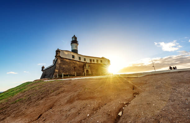 low angle view Lighthouse of Barra in Salvador da Bahia with sun going down