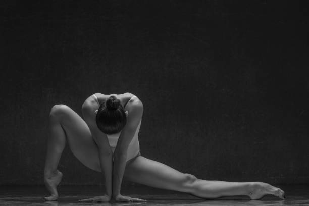 istock Young beautiful female dancer is posing in the studio 941872128