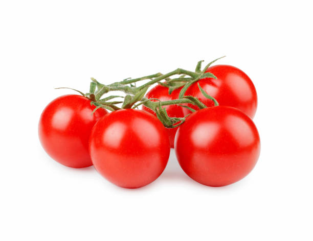 istock Fresh cherry tomatoes with green stem isolated on white background 941872566