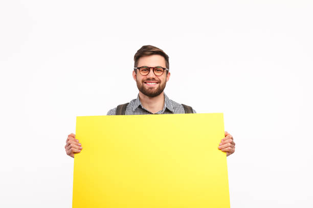 istock Content man showing clean banner on white 941874862