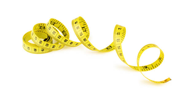 istock Yellow measuring tape isolated on white background 941875840