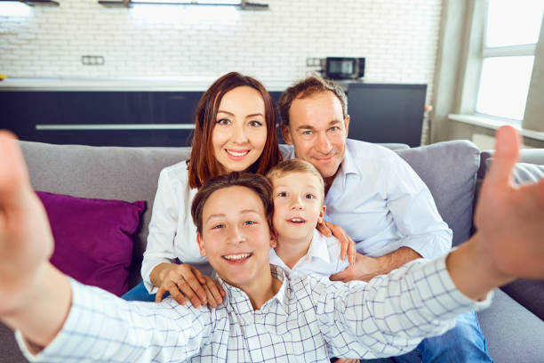 istock A happy family makes selfie at the camera 941878668