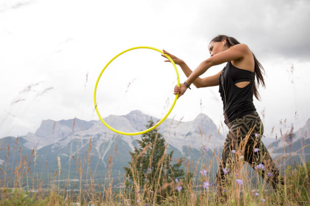 istock Native American woman dances with hoops, in mountains 941879482
