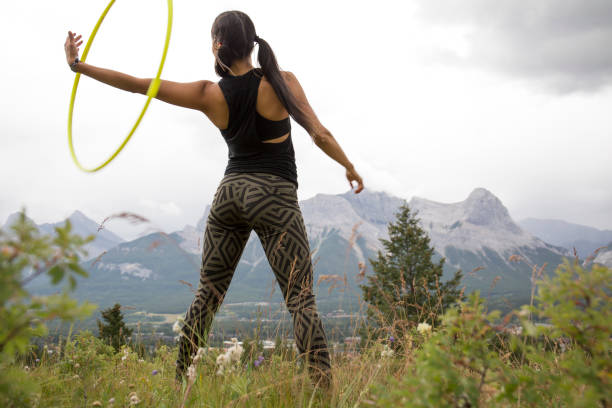 istock Native American woman dances with hoops, in mountains 941879748