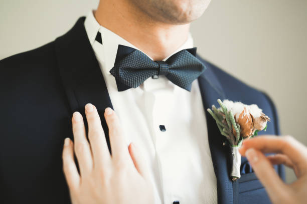istock Beautiful man, groom posing and preparing for wedding 941880010