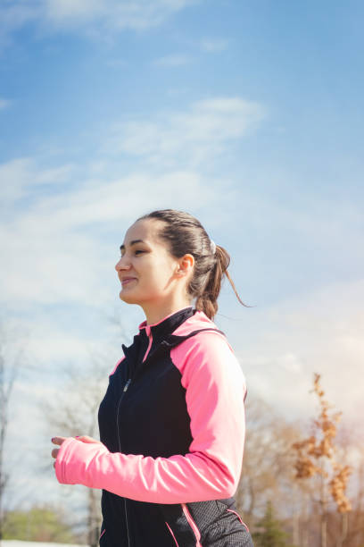 istock Woman Running in Park 941883110