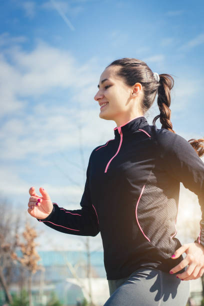 istock Woman Running in Park 941883146