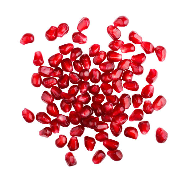 Pomegranate seeds isolated on white background