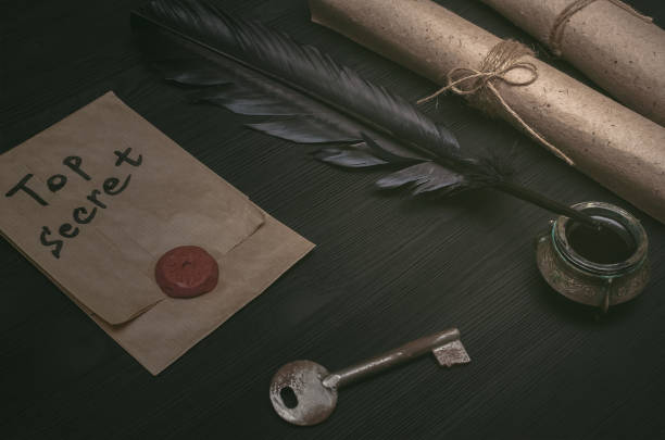 istock Envelope with top secret letter. Secret message. Spy desk table concept. 941896726