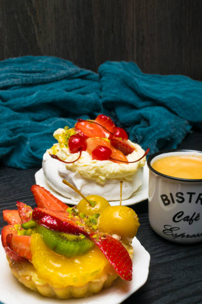 istock delicious cake with fresh fruits and white coffee 941906774