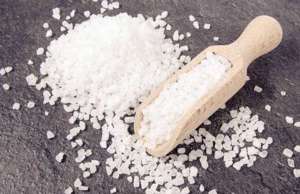istock Coarse sea salt on dark background. Top view. 941908954