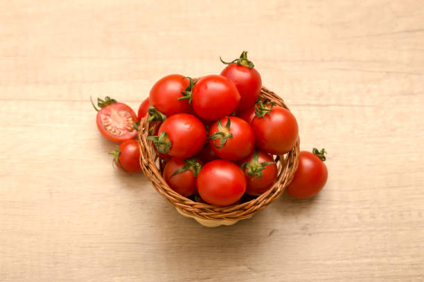 istock cherry tomatoes in a basket on a wooden background 941910268