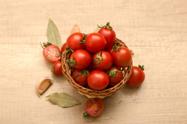 istock cherry tomatoes in a basket on a wooden background 941910276