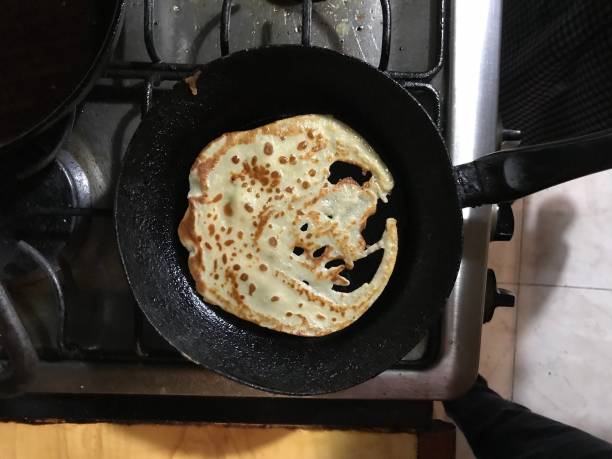 istock Top view of a flawed crepe on a skillet 941912694