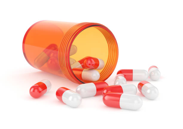 istock Orange pill battle with red pills 941919106