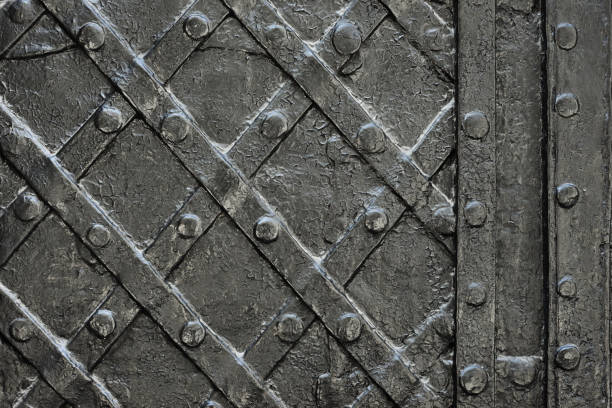 istock black forged iron door for texture or background, ancient architecture of castle gate backdrop 941919186
