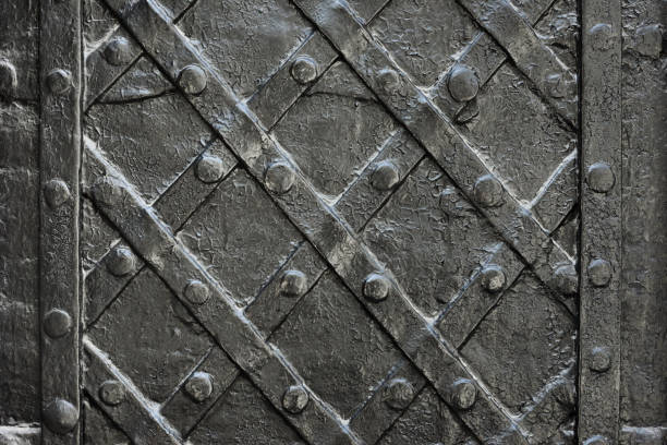 istock black forged iron door for texture or background, ancient architecture of castle gate backdrop 941919308