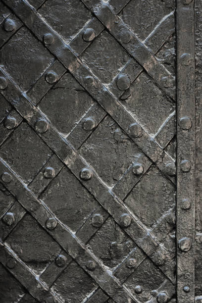 istock black forged iron door for texture or background, ancient architecture of castle gate backdrop 941919430