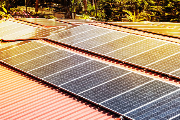 istock Roof with solar panels fragment under sunny blue sky 941924268