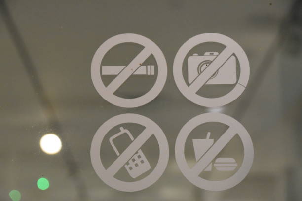 istock A sign: No smoking, no eating, no filming, no talking on the phone 941925706