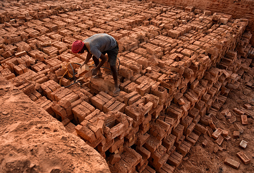 A daily wage labour is working in a brick field of west bengal where they are working in deep polluted environment and hardly earning 2 - 3 & a day.