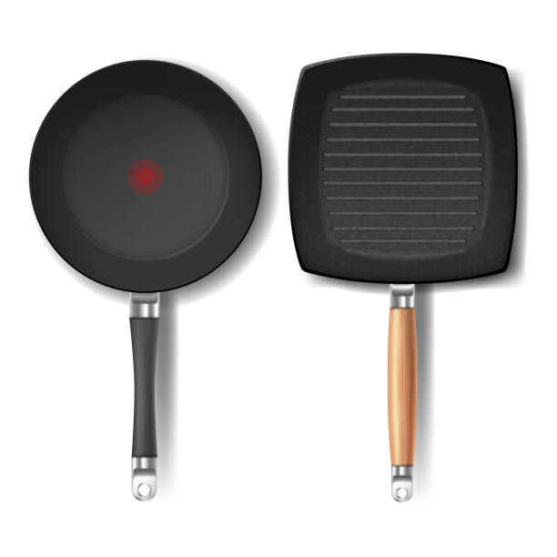Vector set with two realistic black frying pans Vector set with two realistic black frying pans, round and square shape, with red thermo-spot indicator and non-stick coating, isolated on white background. Cookware for frying and cooking food stuck in room stock illustrations