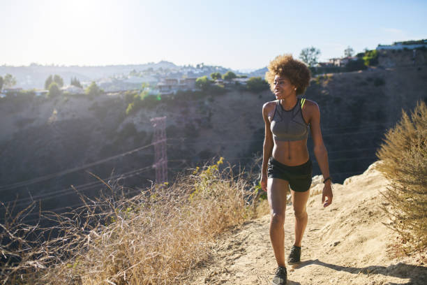 istock athletic african american woman walking runyon canyon 941932386