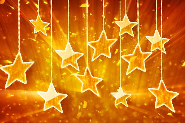 istock orange hanging stars and bokeh lights 941934578