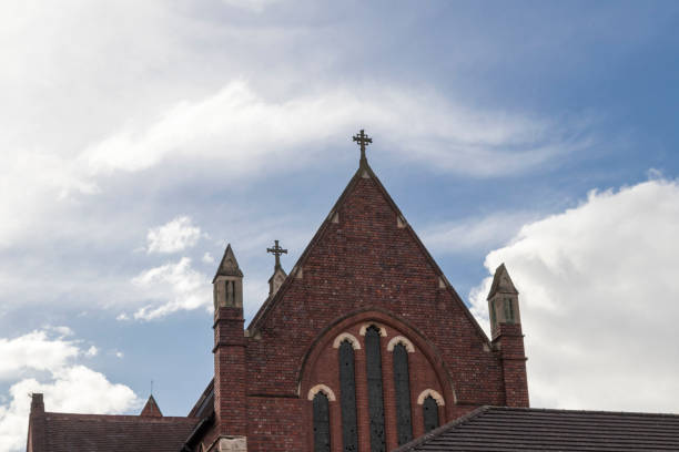 istock Old brick church and blue sky 941935010