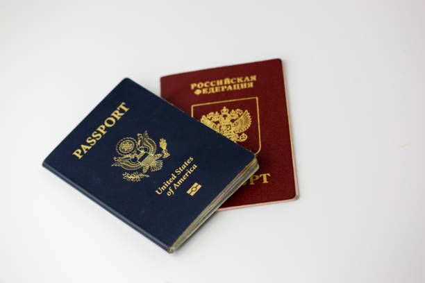 istock US and Russian Passports arranged on white isolated 941939046