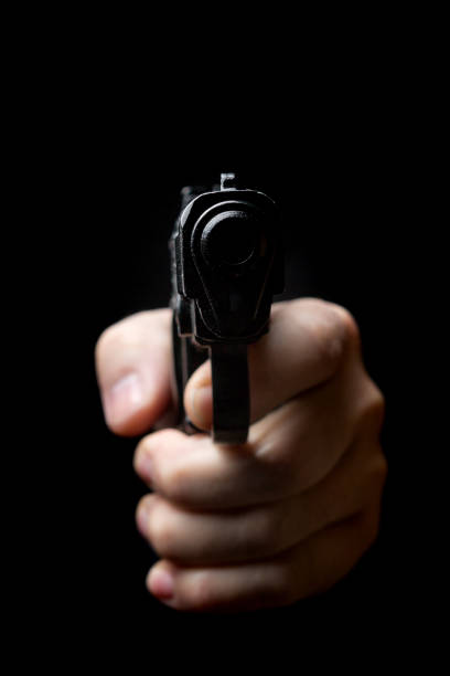 istock gun in the hand of man 941947496