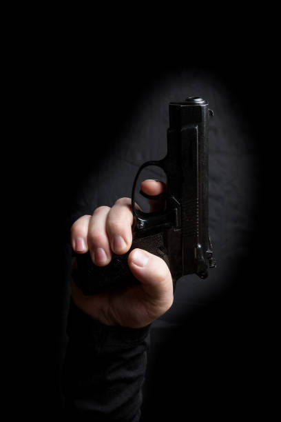 istock gun in the hand of man 941949522