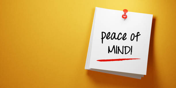 istock White Sticky Note with Peace Of Mind Message And Red Push Pin On Yellow Background 941949856