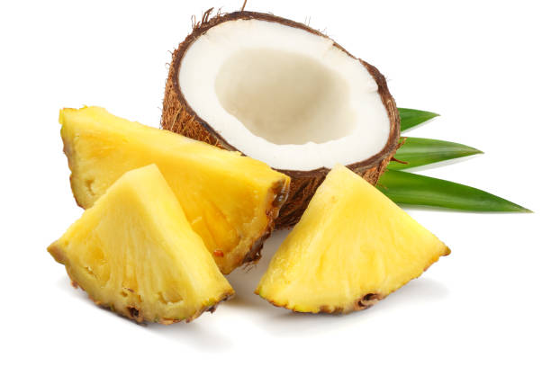 istock Coconut with pineapple and green leaves isolated on white background 941950030