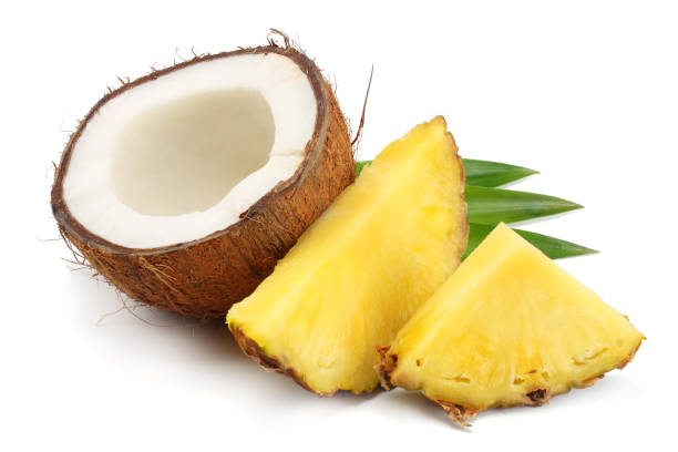 istock Coconut with pineapple and green leaves isolated on white background 941950034