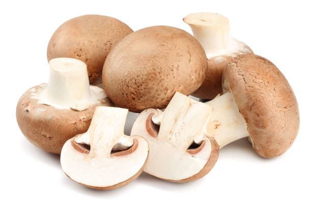istock Fresh champignon mushrooms isolated on white background 941950118