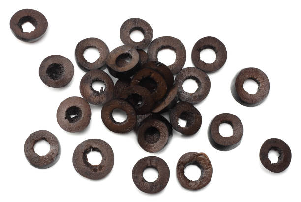 istock Marinated slices black olives isolated on white background. top view 941950186