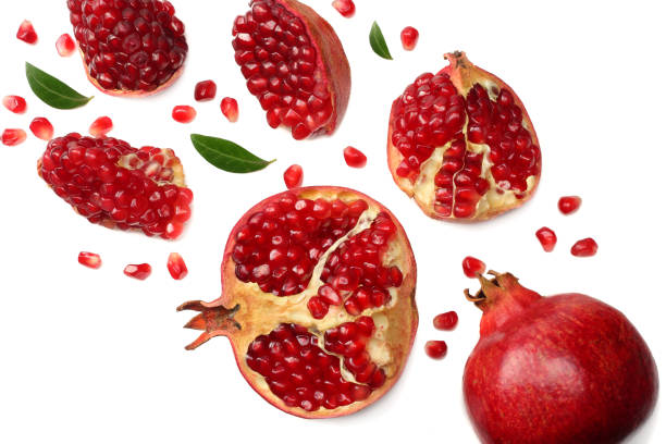 istock pomegranate fruit with green leaves isolated on a white background top view 941950226