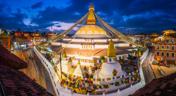 istock Kathmandu Boudhanath Buddhist stupa prayer flags illuminated dusk panorama Nepal 941954952