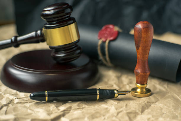 istock Old notarial wax seal and stamp on judicial table 941966582