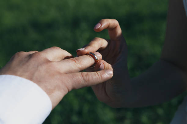 istock Man giving an engagement ring to his girlfriend 941968850