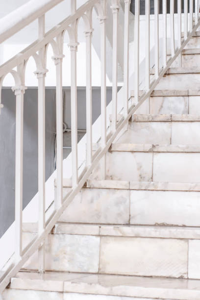 istock Beautiful Marble staircase with white railing leading upwards 941969008