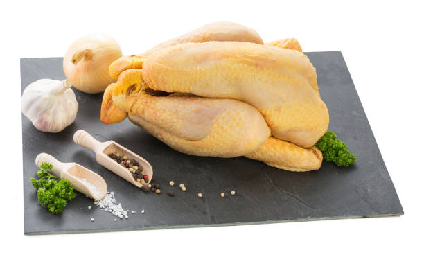 istock Raw chicken ready to be cooked on a black slate 941969286