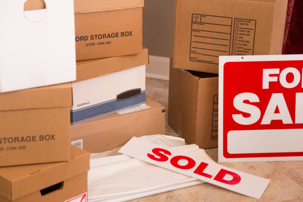 istock Cardboard moving boxes stacked in new home. 941973028